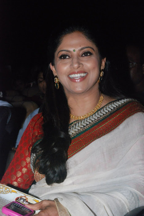 nadhiya spicy smiling in saree at event